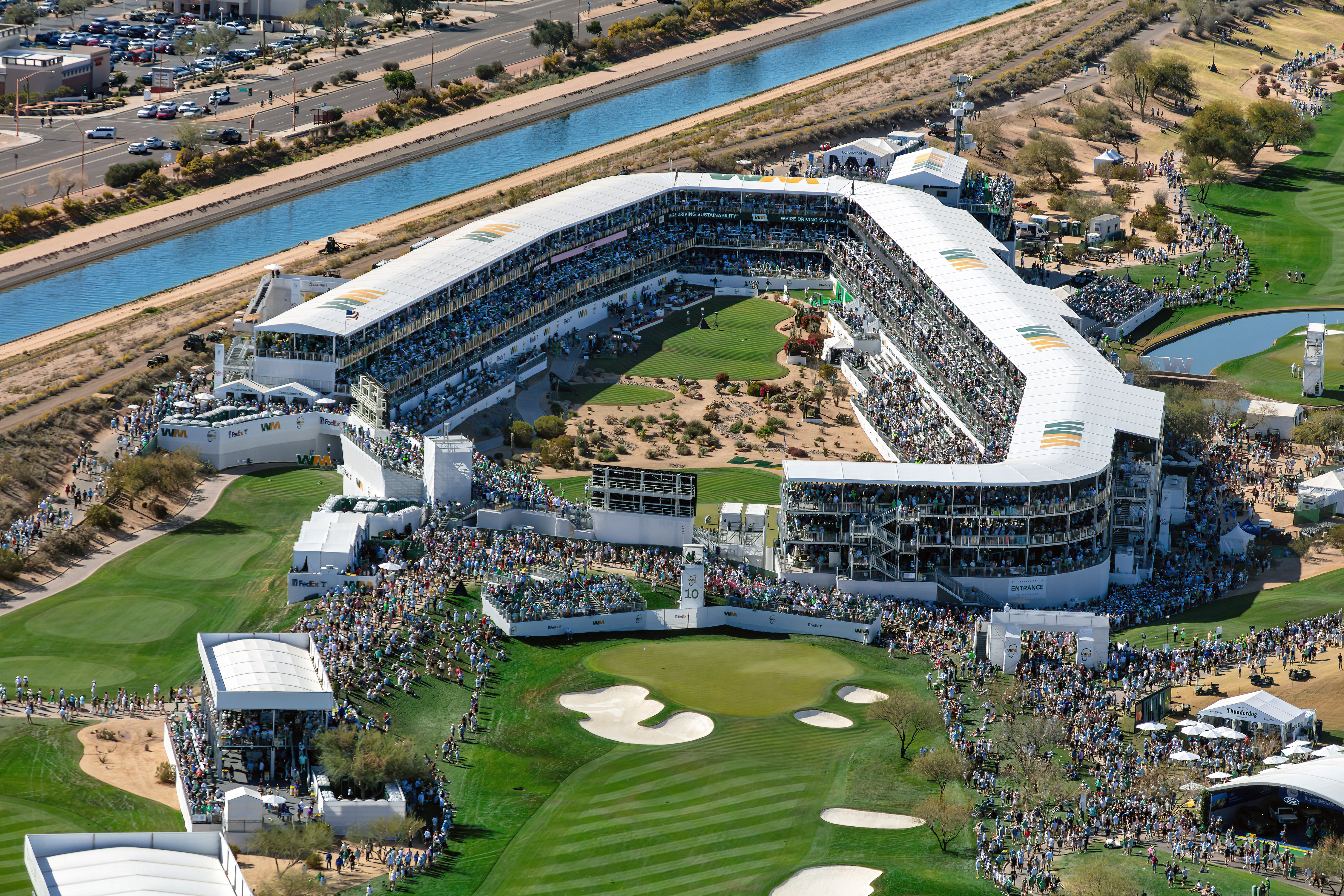InProduction multi-story hospitality and grandstand seating at the WM Phoenix Open’s 16th-hole Coliseum, filled with fans during the tournament.”