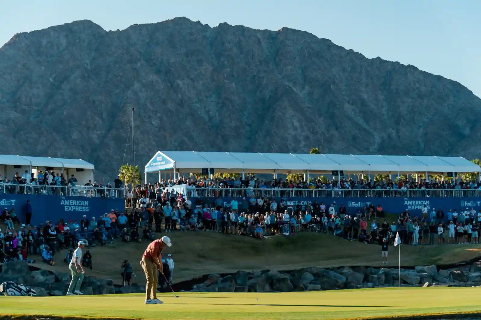 Golf tournament with spectators and custom temporary hospitality and grandstand structures.