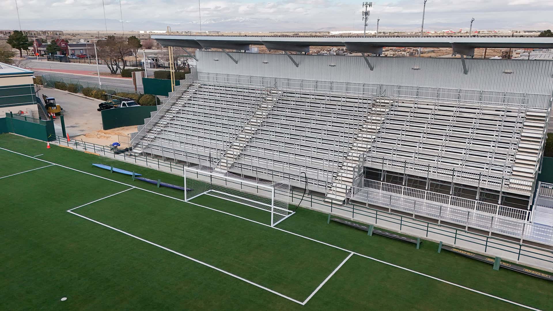 InProduction custom modular grandstands installed at AV Alta FC’s Lancaster Municipal Stadium, providing an 800-seat sideline section and steep SRO supporters’ stand for immediate seating capacity.