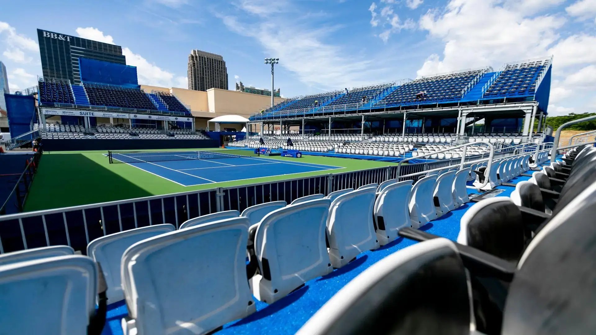 Built from the ground up for the event, the temporary stadium introduced courtside box seats, multi-level hospitality, and integrated video boards to create an elevated center-court viewing environment.