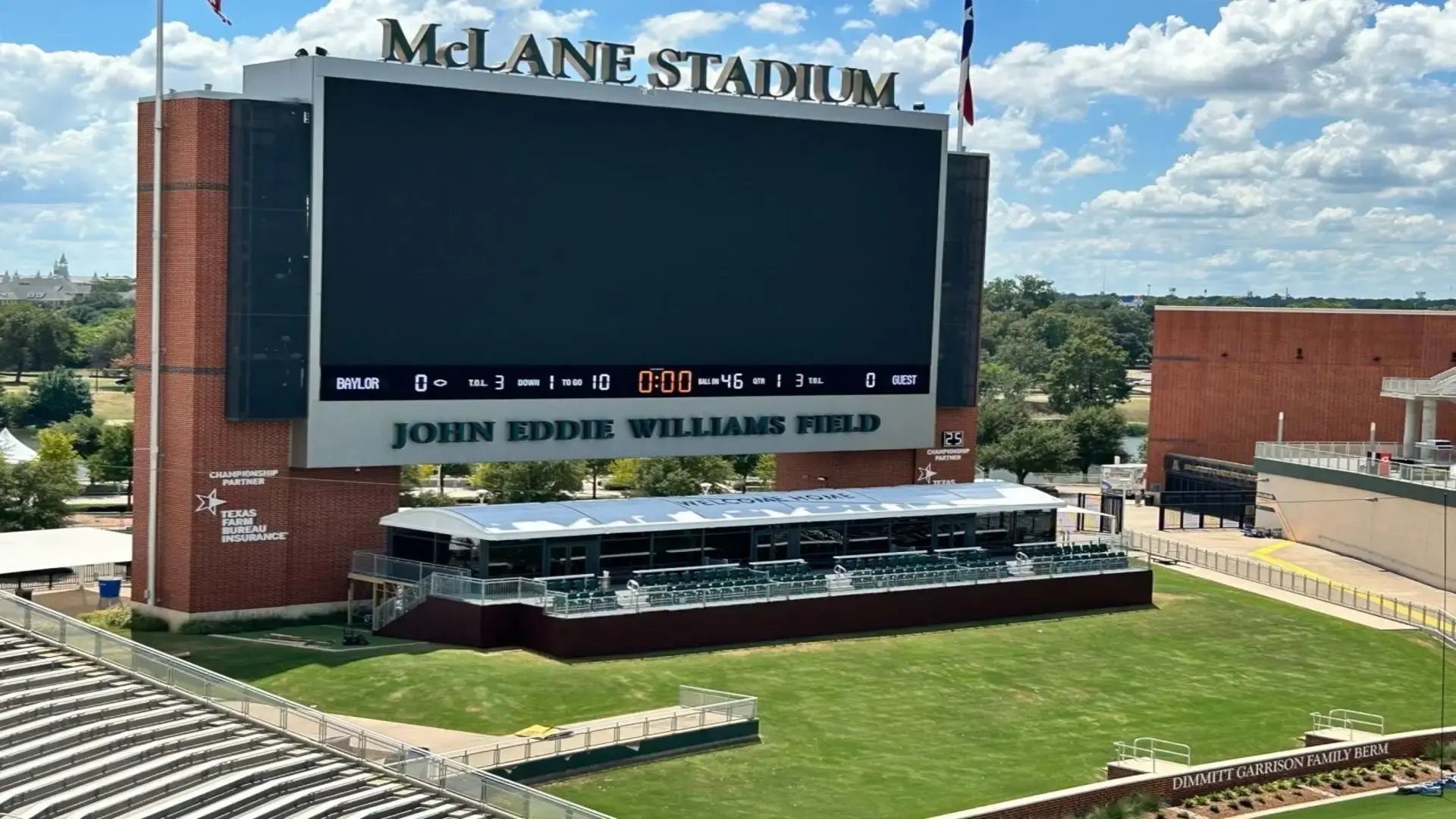 InProduction climate-controlled end-zone hospitality suites installed at Baylor University’s McLane Stadium, featuring an elevated seating deck, premium finishes, and sustainable design elements.