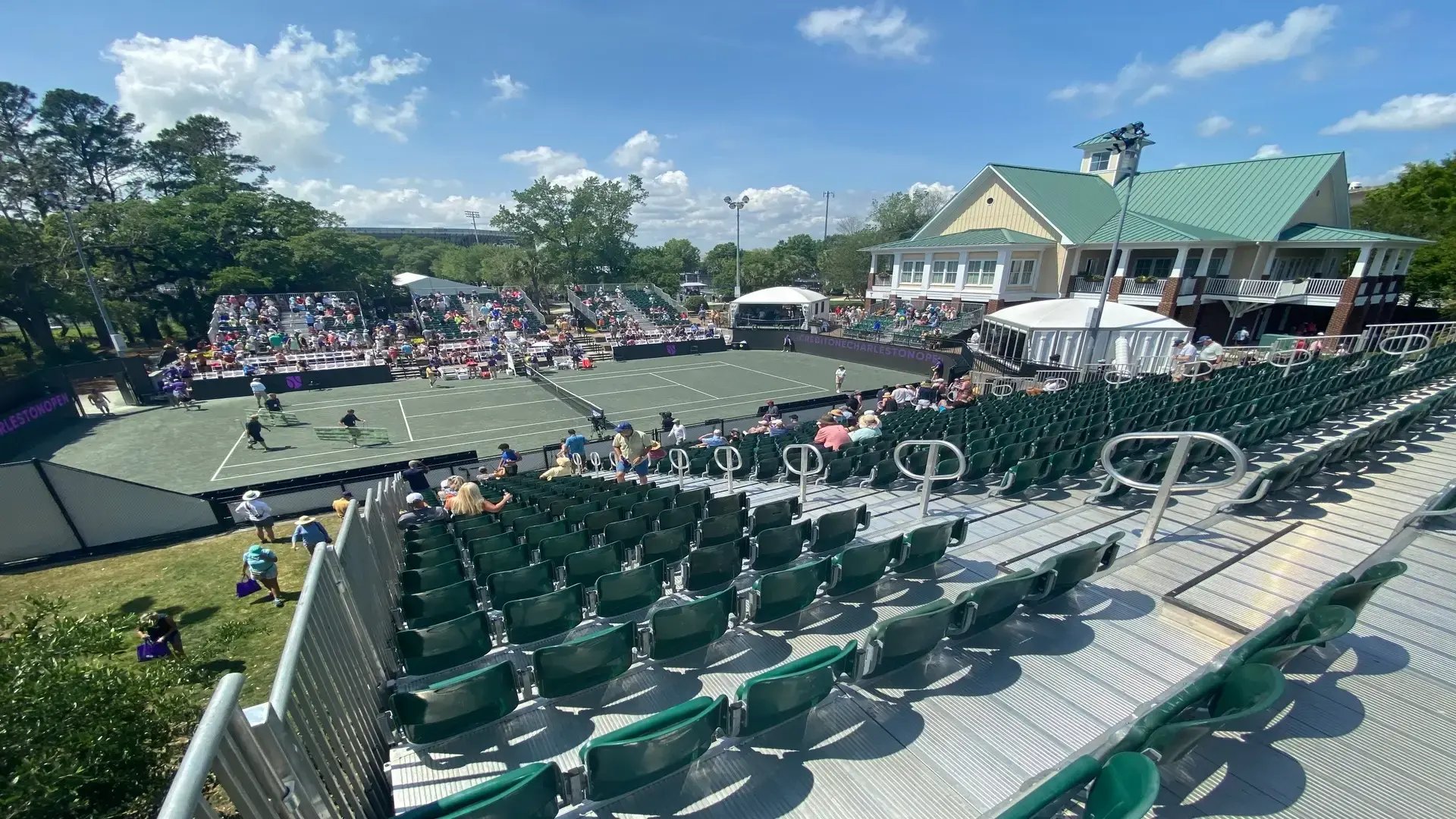 InProduction temporary seating and premium tip-up chairs installed on all-aluminum systems for the Credit One Charleston Open, providing enhanced views overlooking center court.