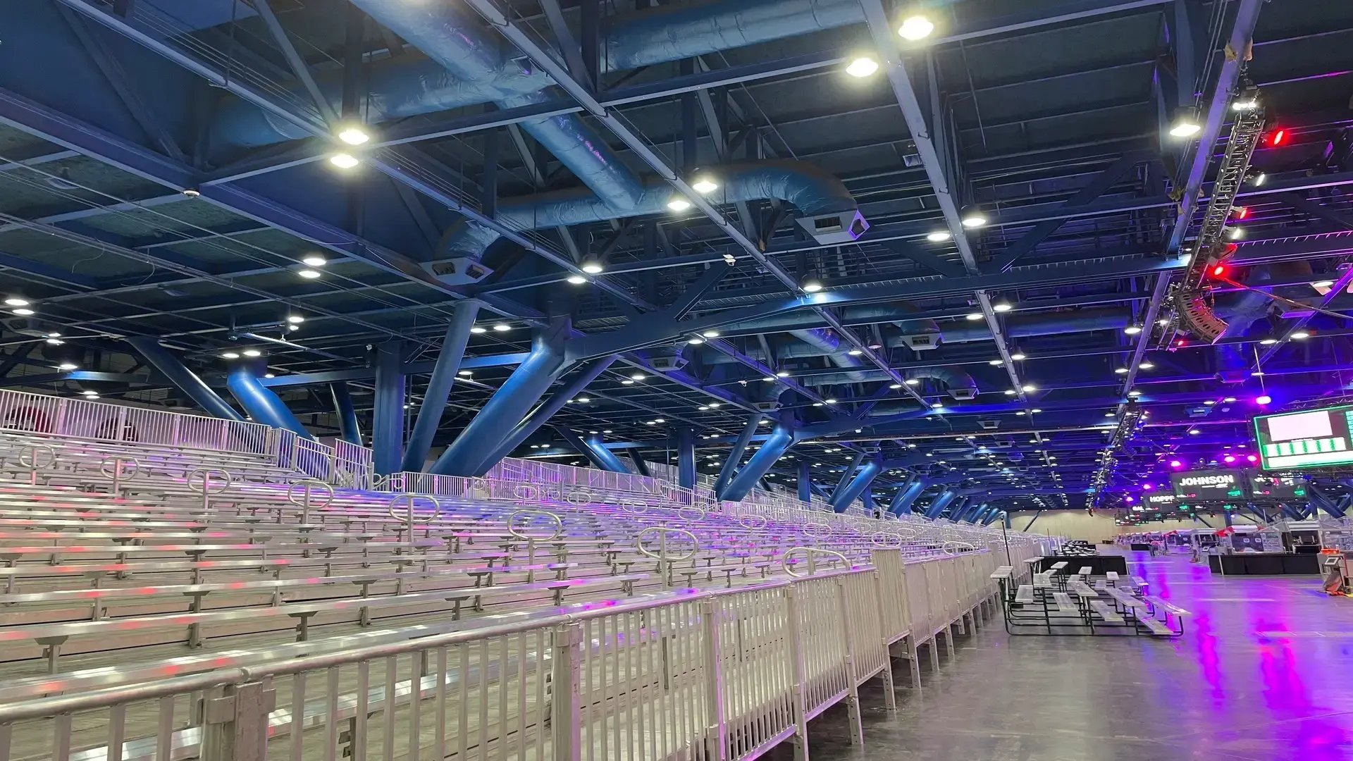 InProduction aluminum bench seating configured for the FIRST Robotics Competition to provide clear broadcast sightlines and organized crowd flow in a complex venue.”