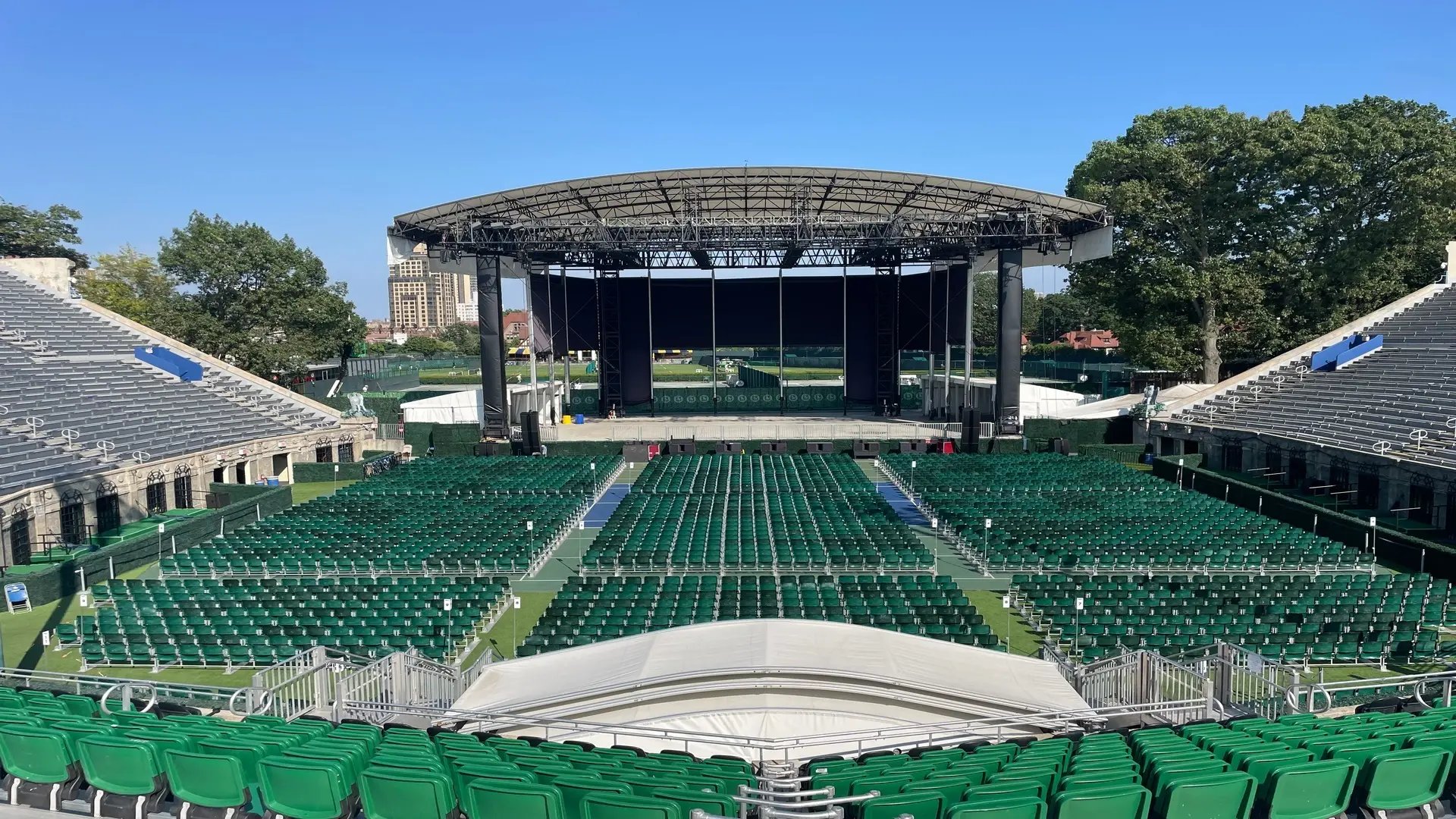 InProduction premium tip-up seating and GA pit installation at Forest Hills Stadium, increasing capacity with clear sightlines toward the stage