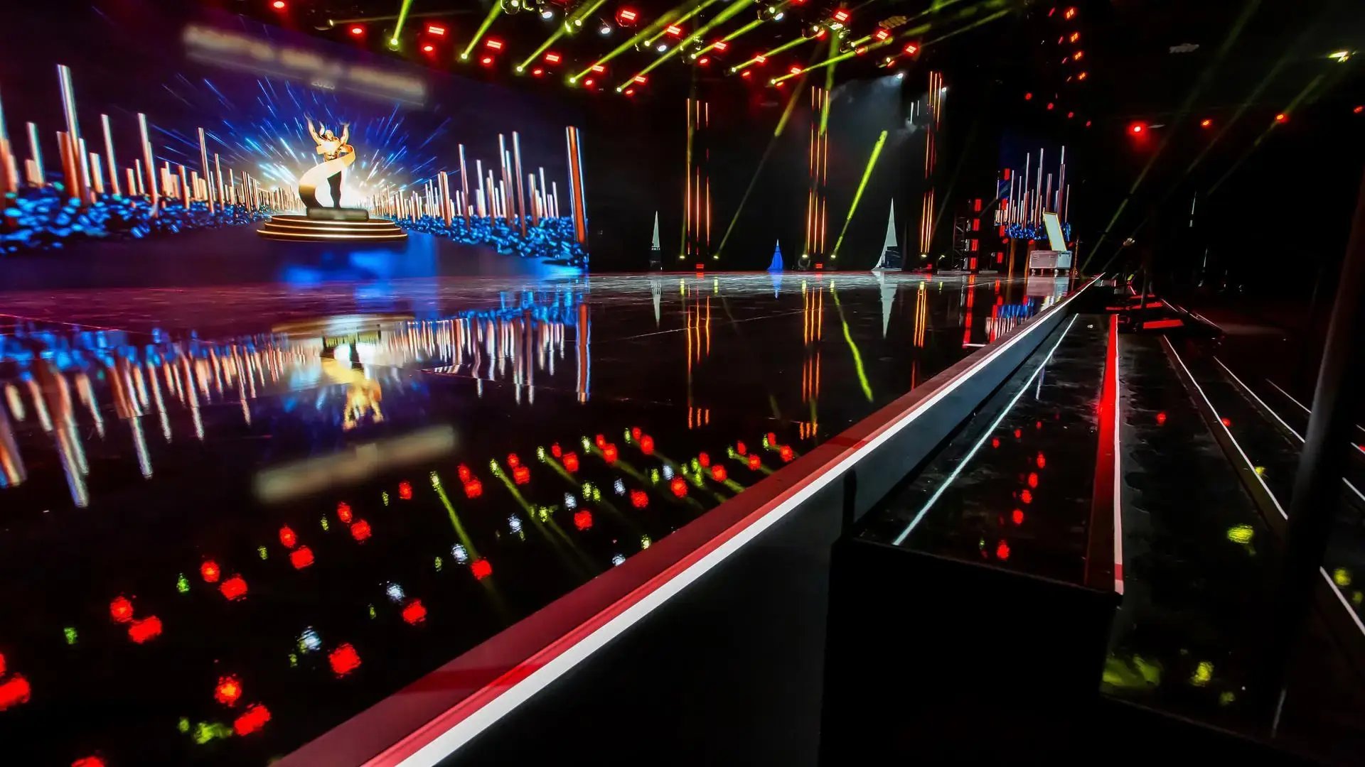 InProduction custom scenic stage with gloss finishes and integrated LED features at the Georgia World Congress Center for a high-impact corporate awards gala.