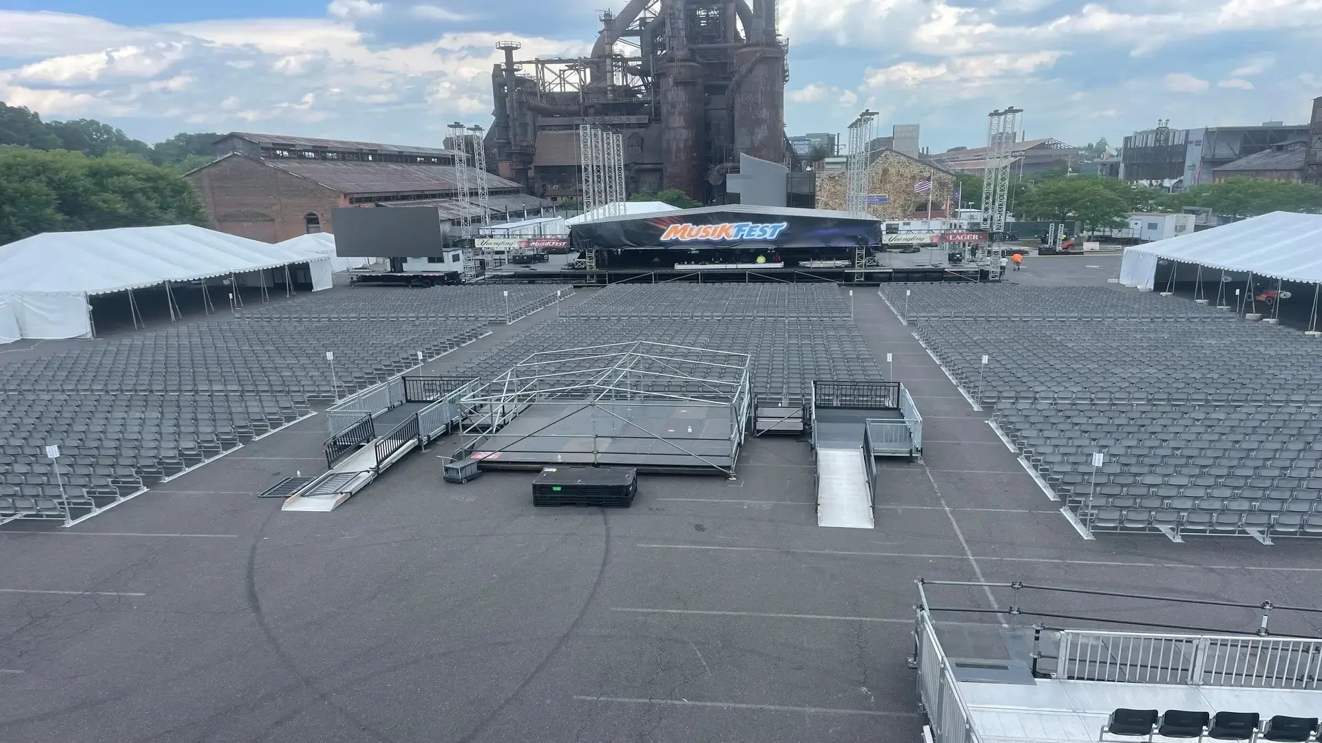 InProduction floor seating installation at Musikfest, providing thousands of comfortable seats with clear sightlines toward the main stage for large festival crowds.