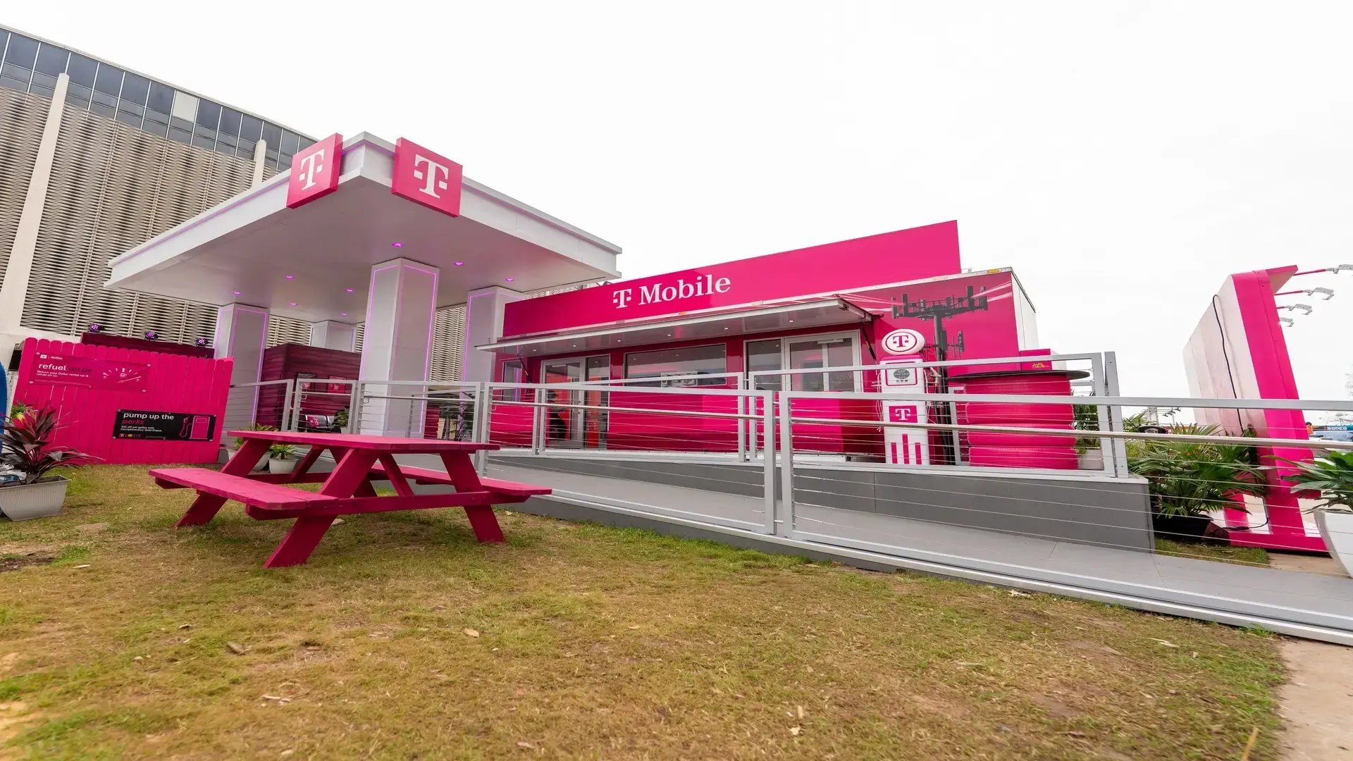 InProduction custom T-Mobile activation structure at the Houston Rodeo featuring bold exterior branding, interior graphics, seating, and integrated engagement areas.