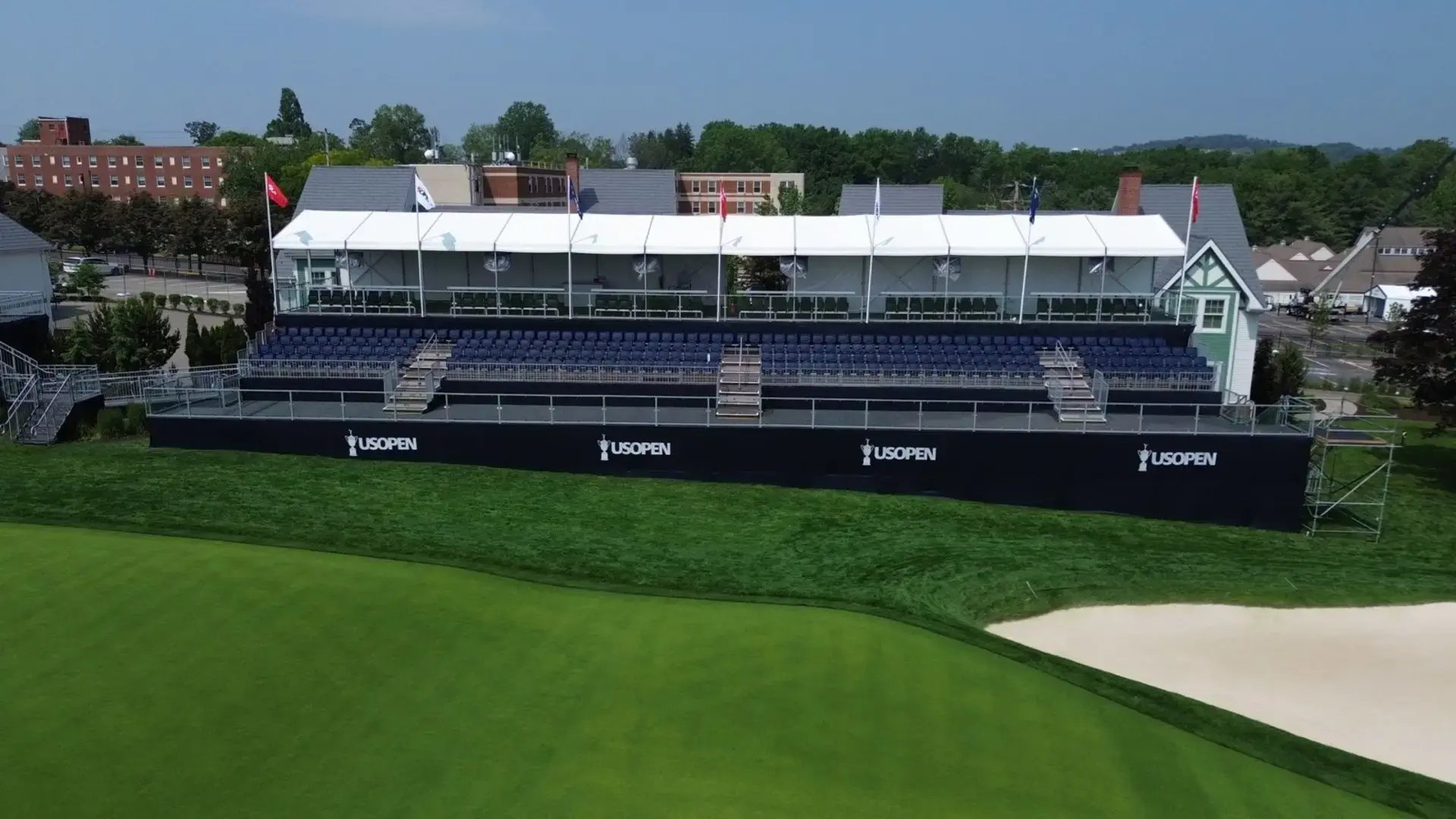 InProduction hospitality structure with adjacent grandstand seating installed for the U.S. Open Championship, supporting large-scale tournament infrastructure.