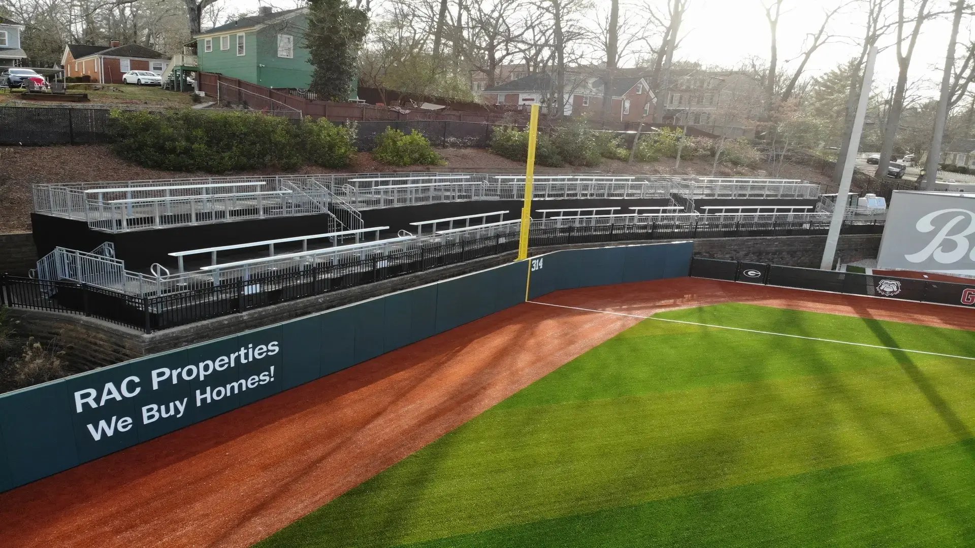 “InProduction multi-tier drink-rail hospitality deck installed in right field at the University of Georgia’s Foley Field, creating new social viewing zones and boosting fan engagement.
