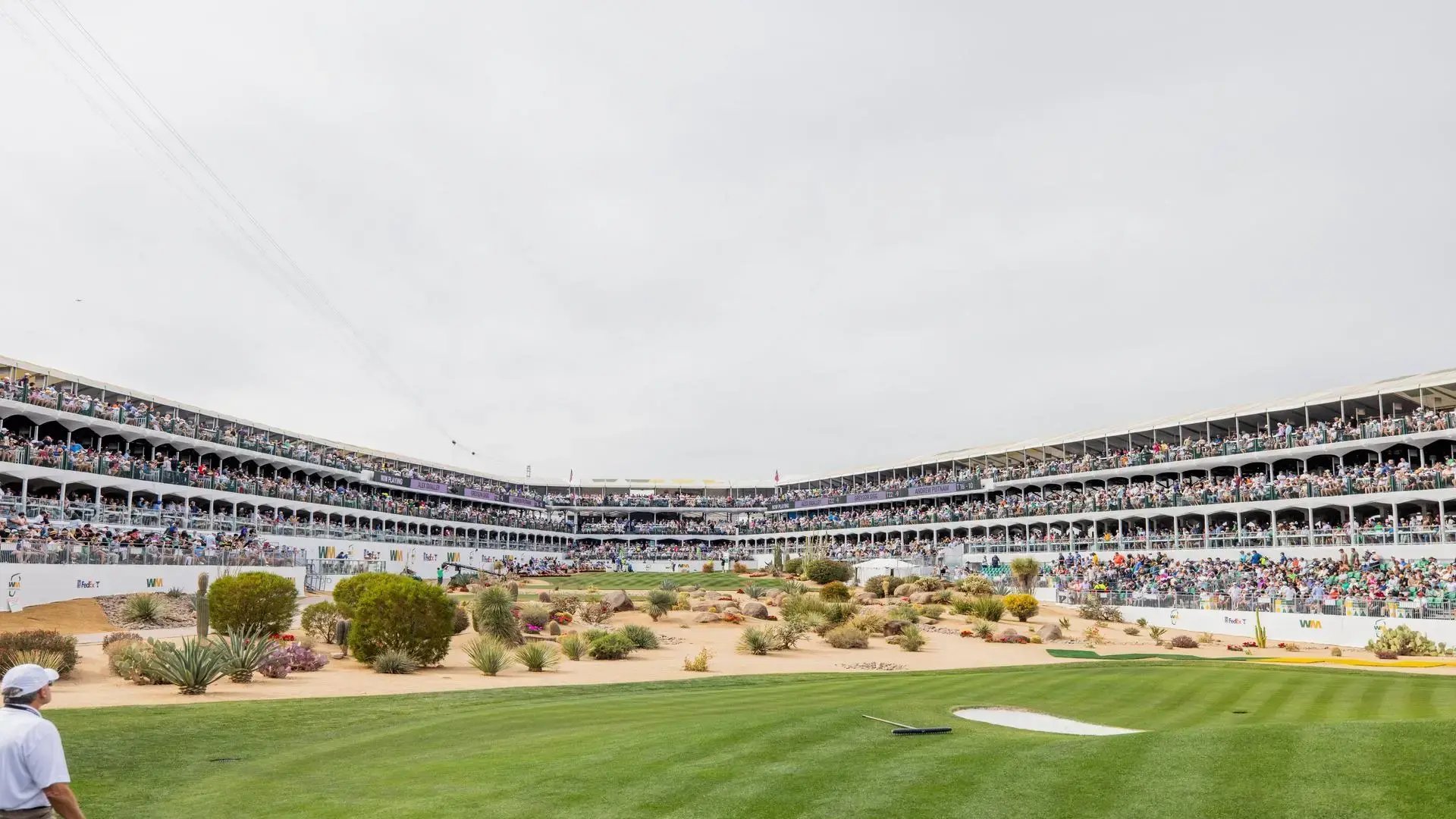 InProduction multi-story hospitality and grandstand seating at the WM Phoenix Open’s 16th-hole Coliseum, filled with fans during the tournament.”