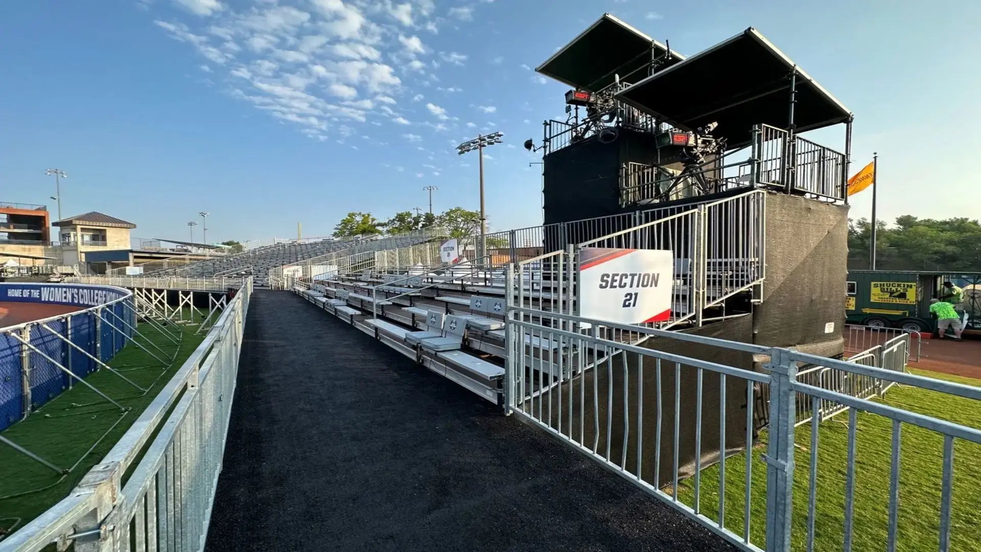 InProduction bench bleacher grandstand seating and strategically placed camera towers installed for the Women’s College World Series, providing closer views and enhancing both in-stadium and broadcast experiences.