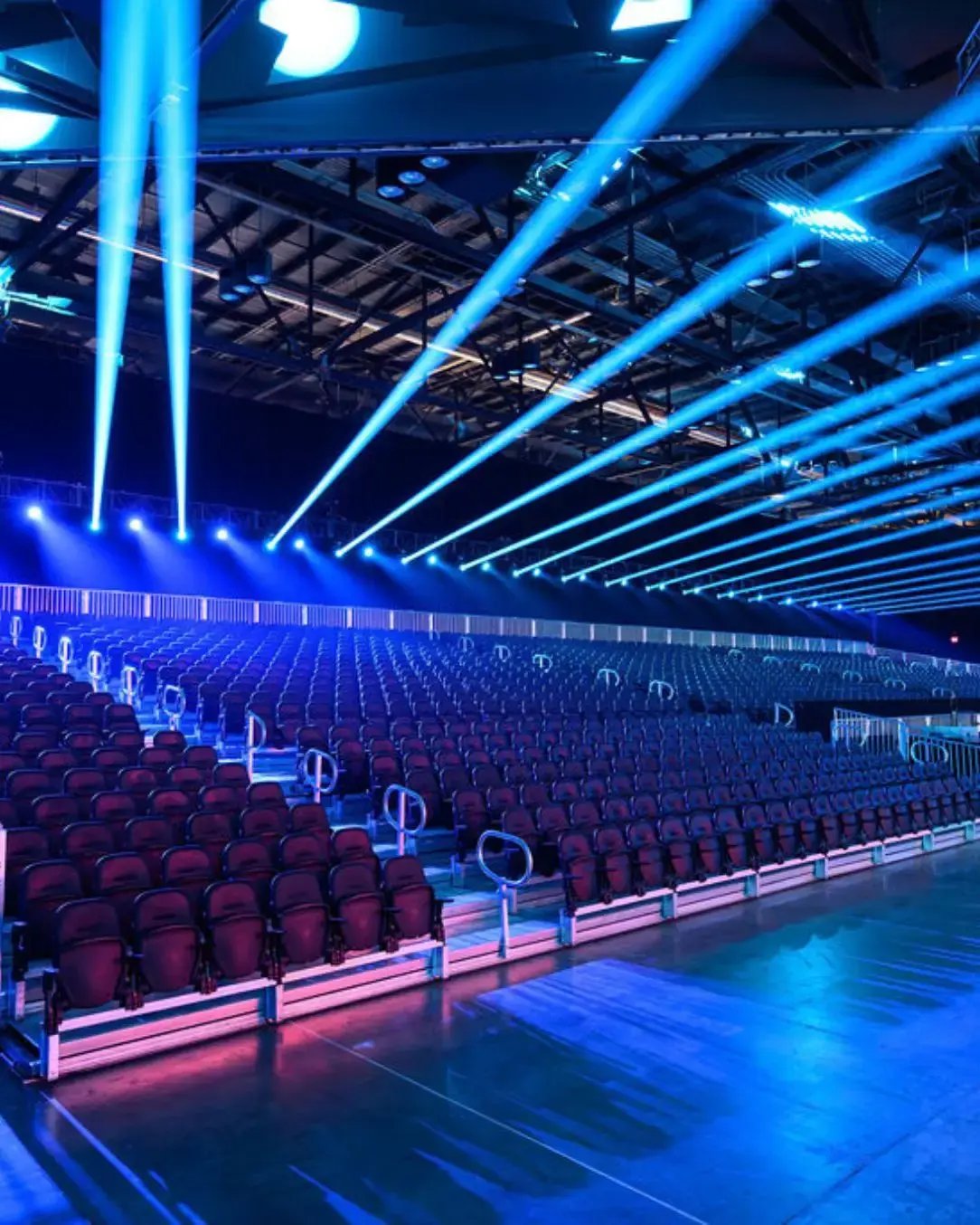 Modular audience seating arranged in a convention center to support a general session with clear sightlines and professional presentation. 