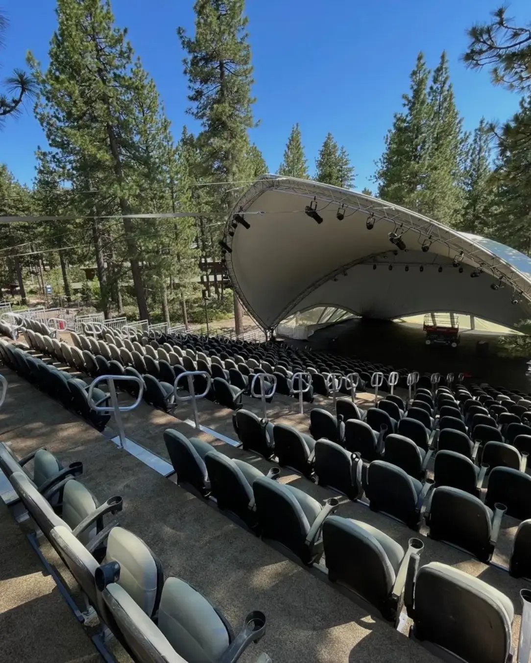 Modular seating built into a mountainside to provide elevated views and increased capacity for a summer concert series.