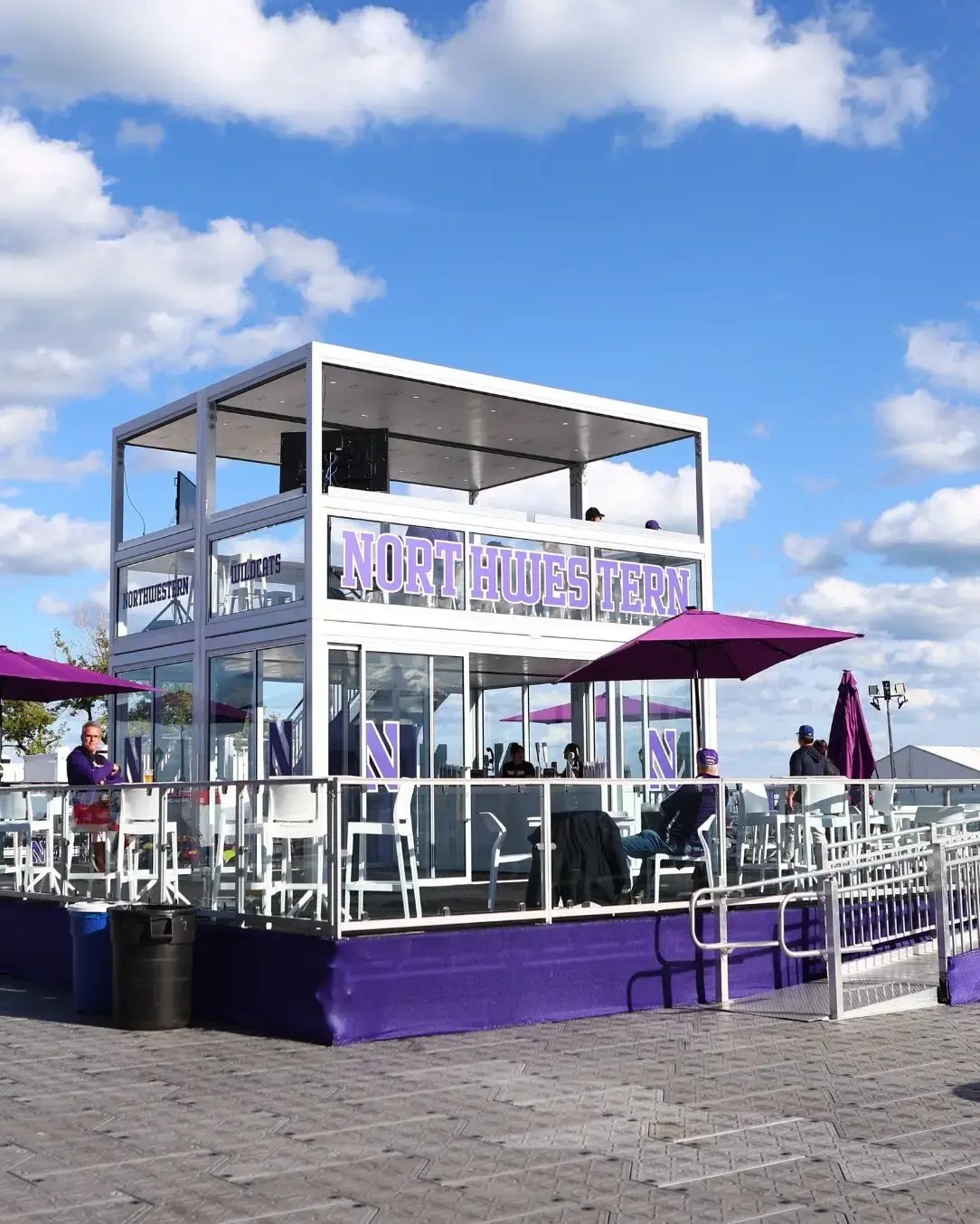 Spacecube structure used as a sponsor-branded tailgating and fan engagement hub, enhancing visibility and elevating the live event experience. 