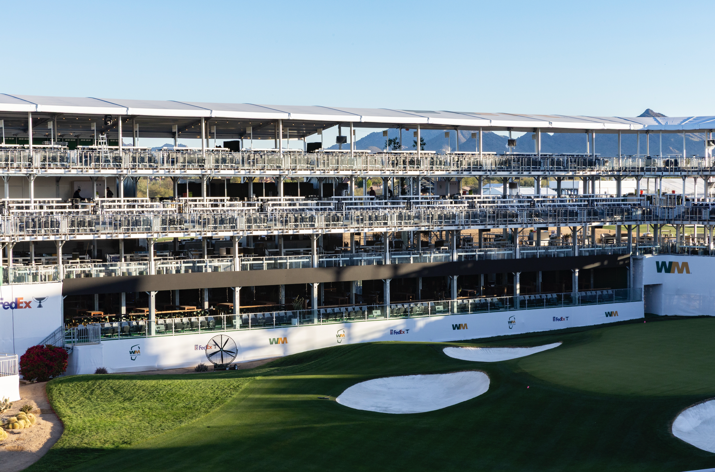 InProduction multi-story hospitality and grandstand seating at the WM Phoenix Open’s 16th-hole Coliseum, filled with fans during the tournament.”