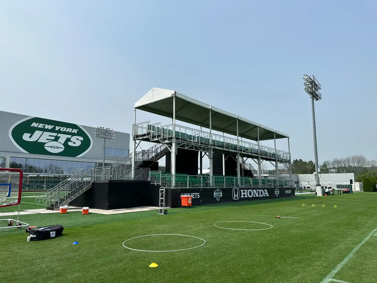 InProduction state-of-the-art bleacher seating with shaded tent structures for a New York Jets event